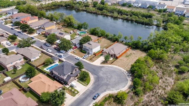 aerial view with a water view and a residential view