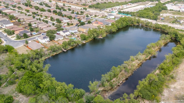 birds eye view of property featuring a residential view and a water view