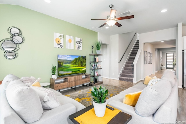 living area with visible vents, stairway, recessed lighting, wood finished floors, and a ceiling fan