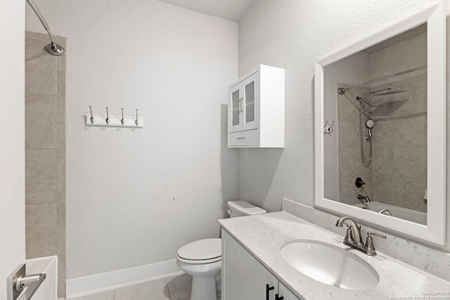 bathroom featuring vanity, baseboards, tile patterned flooring, shower / bathing tub combination, and toilet