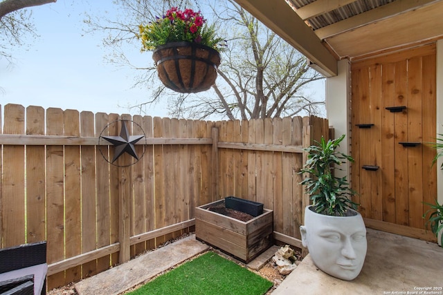 view of patio featuring fence