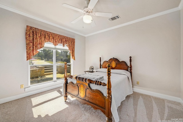 bedroom featuring visible vents, carpet floors, baseboards, and crown molding