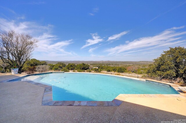 pool with a patio