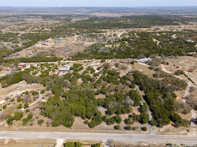 birds eye view of property with a rural view