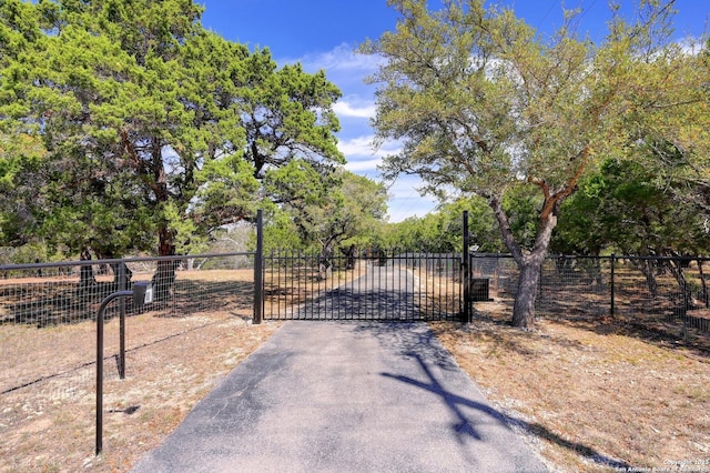 view of gate featuring fence