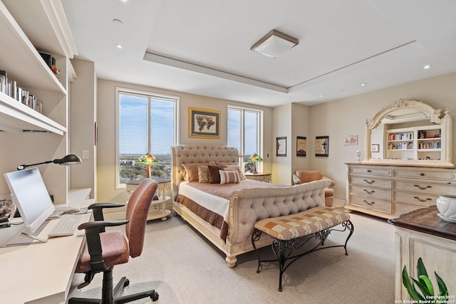 carpeted bedroom featuring a tray ceiling and recessed lighting