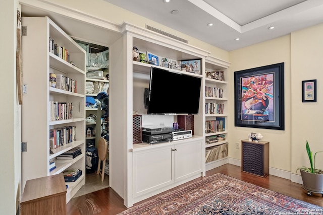 interior space featuring visible vents, recessed lighting, baseboards, and dark wood-style flooring