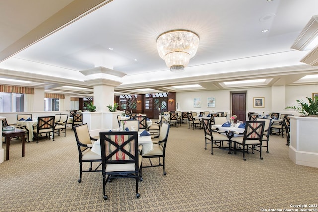 carpeted dining area with recessed lighting and a notable chandelier