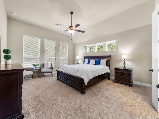 bedroom with visible vents, baseboards, ceiling fan, light colored carpet, and lofted ceiling