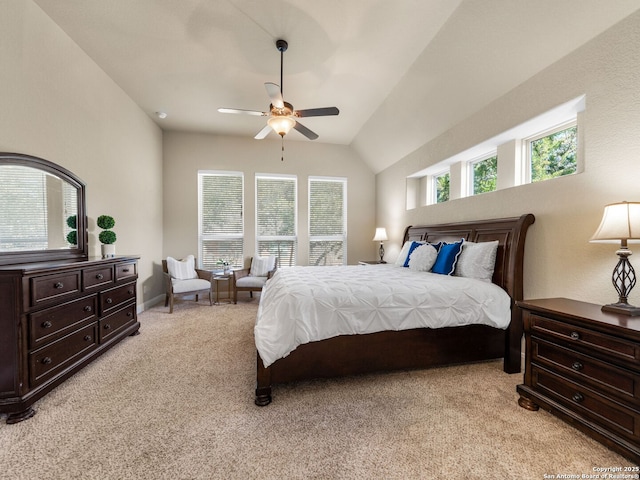 bedroom with light colored carpet, a ceiling fan, and vaulted ceiling