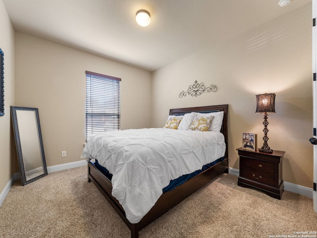 carpeted bedroom with baseboards