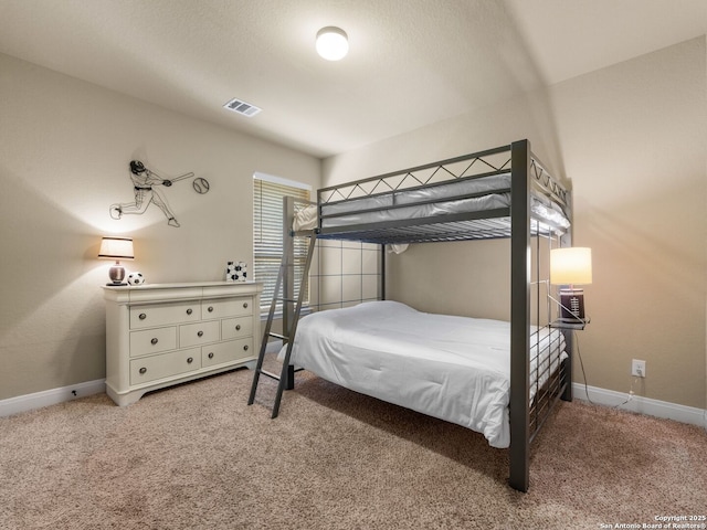 bedroom featuring baseboards, visible vents, and carpet floors