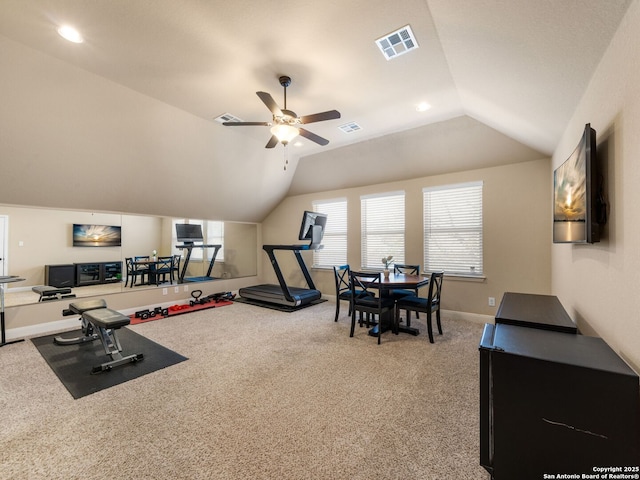 exercise area with a ceiling fan, visible vents, baseboards, lofted ceiling, and carpet flooring