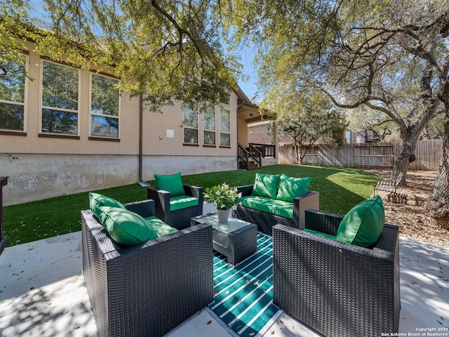 view of patio / terrace with outdoor lounge area and fence