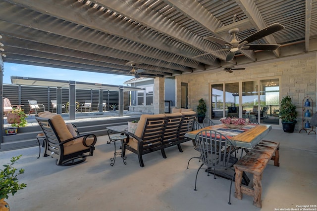 view of patio / terrace with ceiling fan, an outdoor hangout area, and outdoor dining space