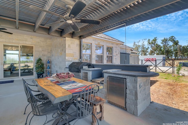 view of patio / terrace with outdoor dining space, a ceiling fan, fence, area for grilling, and a grill