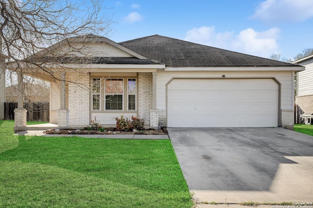 ranch-style house with brick siding, concrete driveway, a front yard, roof with shingles, and an attached garage