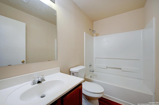 full bathroom featuring toilet, vanity, and shower / bathing tub combination