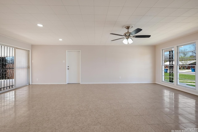 empty room with recessed lighting, baseboards, and ceiling fan