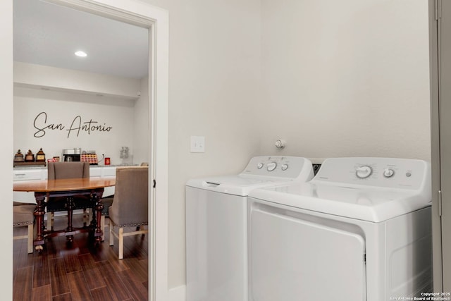 washroom featuring recessed lighting, independent washer and dryer, dark wood-style flooring, and laundry area