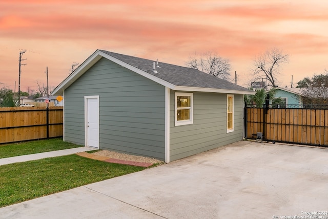 view of outbuilding featuring an outbuilding and fence