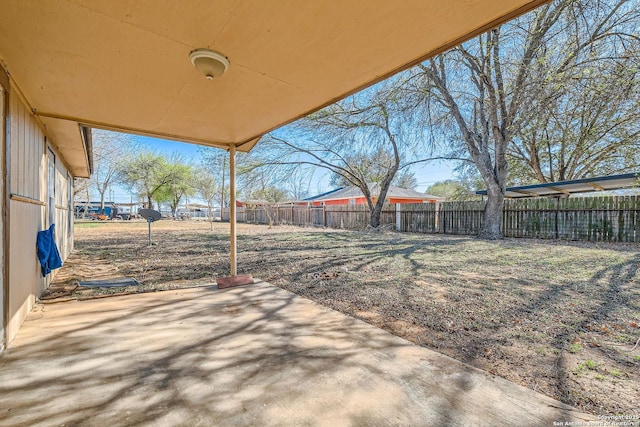 view of patio / terrace featuring fence