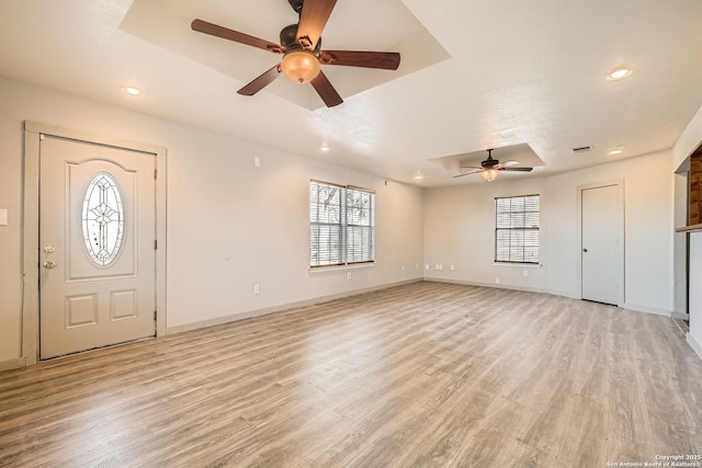 foyer with recessed lighting, a ceiling fan, light wood-type flooring, and baseboards