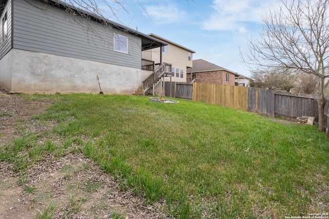 view of yard featuring stairway and fence private yard