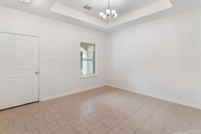 unfurnished room with visible vents, a notable chandelier, baseboards, light tile patterned floors, and a raised ceiling