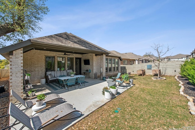 576 Tobacco, New Braunfels, TX 78132 - back of property with a ceiling fan, fence, brick siding, a patio, and a lawn