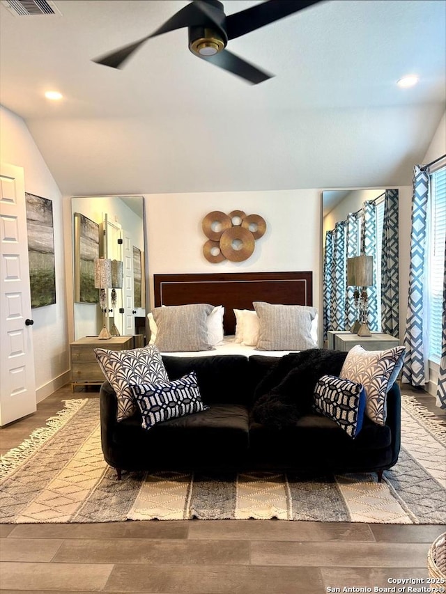 bedroom with visible vents, ceiling fan, lofted ceiling, recessed lighting, and wood finished floors