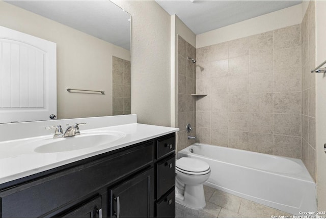 bathroom featuring vanity, tile patterned floors, toilet, and shower / bathing tub combination