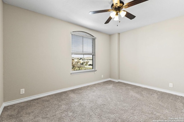 empty room with baseboards, carpet floors, and a ceiling fan