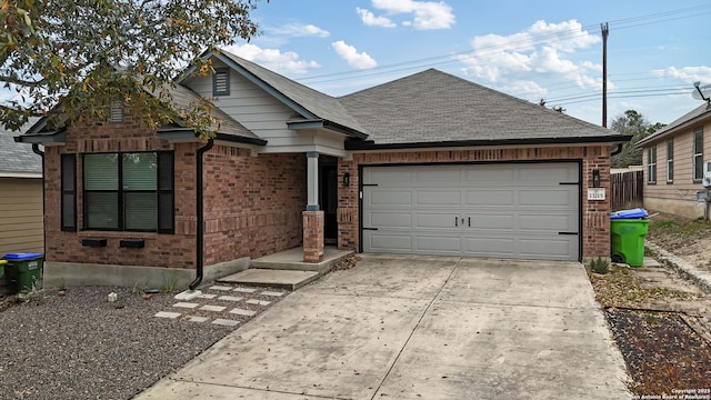 view of front of home with brick siding, roof with shingles, concrete driveway, and an attached garage