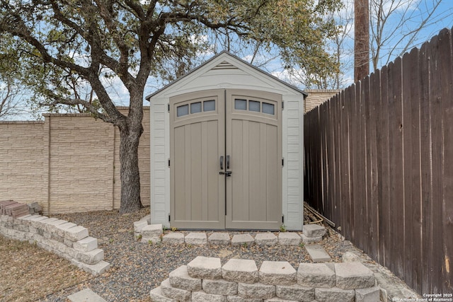 view of shed featuring a fenced backyard