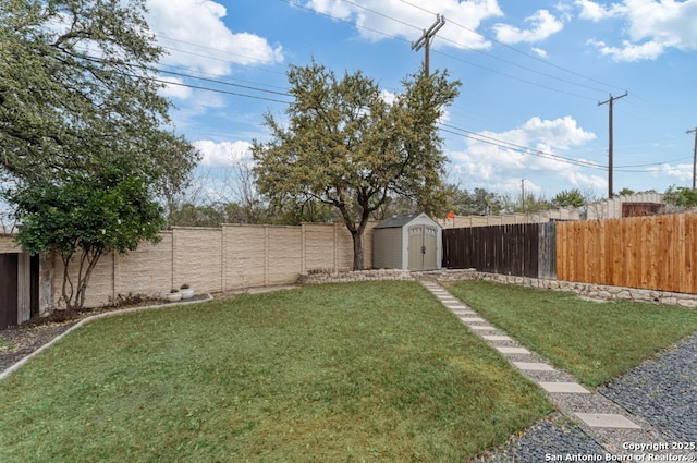 view of yard with a storage shed, a fenced backyard, and an outdoor structure