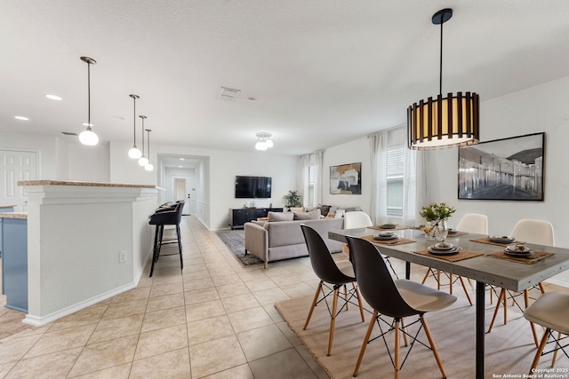 dining room with light tile patterned flooring and visible vents