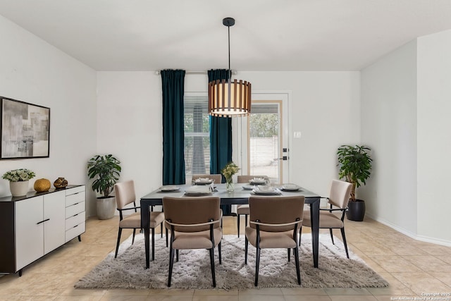 dining room featuring baseboards