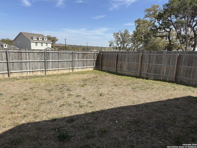 view of yard featuring a fenced backyard