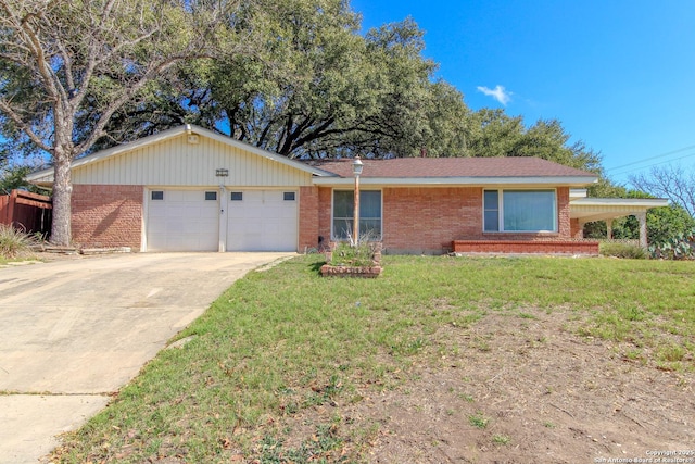 ranch-style house with concrete driveway, an attached garage, brick siding, and a front yard