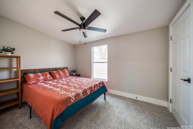 carpeted bedroom featuring baseboards and a ceiling fan