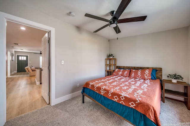 bedroom with carpet flooring, baseboards, and ceiling fan