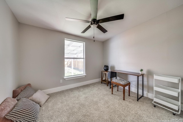 office featuring a ceiling fan, baseboards, and carpet floors