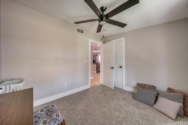 carpeted bedroom with a ceiling fan, baseboards, visible vents, and a closet