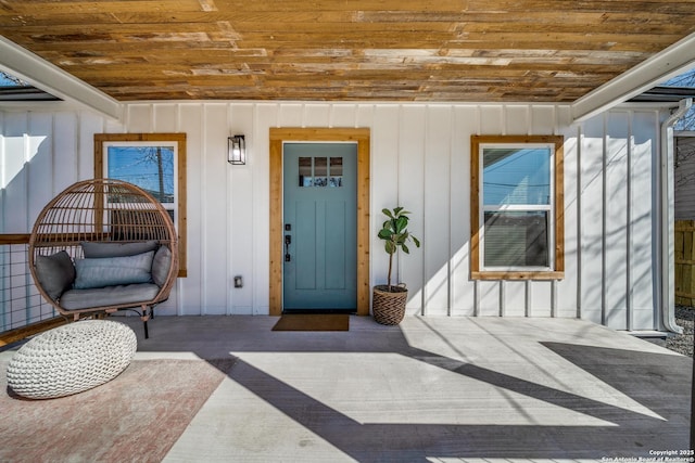 doorway to property featuring board and batten siding