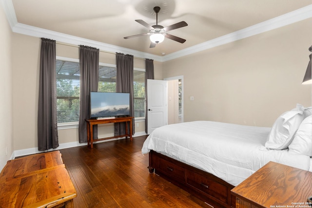 bedroom featuring baseboards, a ceiling fan, ornamental molding, and dark wood-style flooring