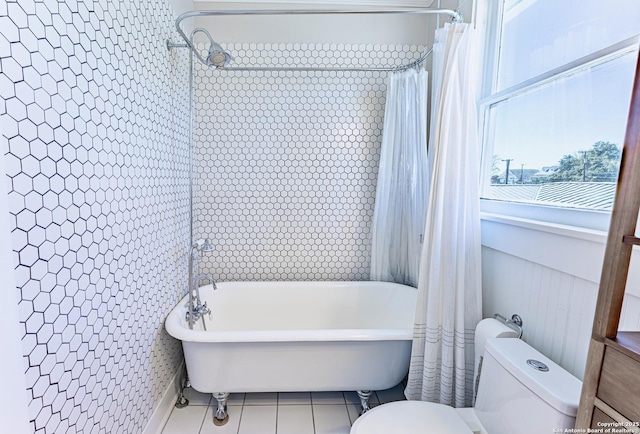 bathroom with a bath, curtained shower, tile patterned floors, and toilet