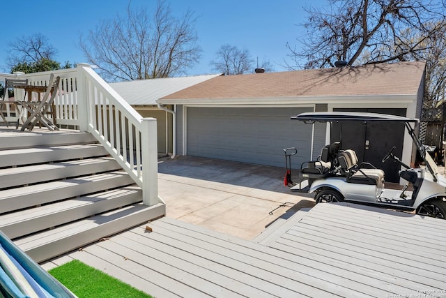 wooden terrace with a garage