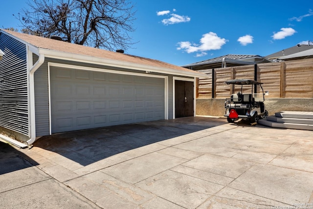 garage featuring fence