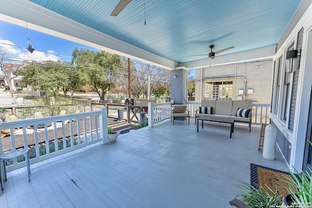 view of patio / terrace featuring an outdoor living space, ceiling fan, and fence